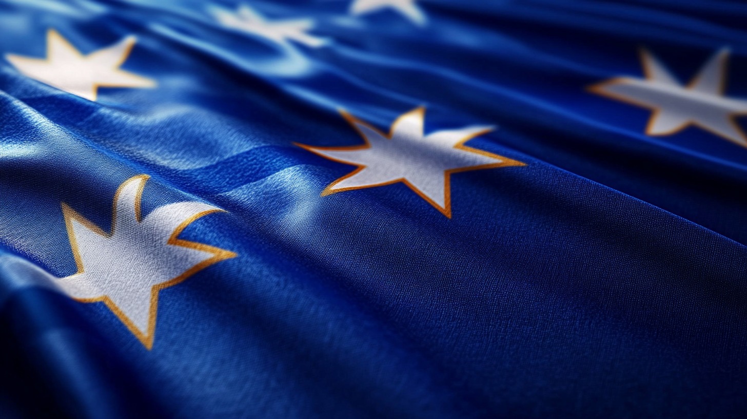 Close-up of the stars from Australia's national flag, emphasizing the vibrant blue background and golden-edged white stars