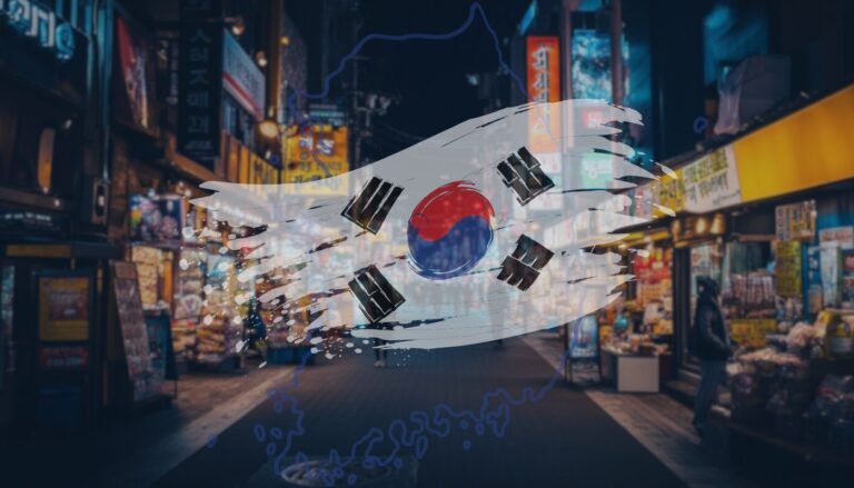 The South Korean flag superimposed on a vibrant night market scene filled with neon signs and bustling activity